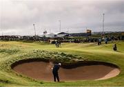 18 July 2025; Shane Lowry of Ireland plays out of a bunker on the 12th hole during day two of The 153rd Open Championship at Royal Portrush Golf Club in Portrush, Antrim. Photo by Ramsey Cardy/Sportsfile