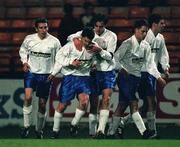 27 November 1998; Ciaran Kavanagh of UCD, second from left, is congratulated by team-mates after scoring his sides first goal during the  Harp Lager National League Premier Division match between Shelbourne and UCD at Tolka Park in Dublin. Photo by Aoife Rice/Sportsfile.