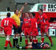 11 October 1998; Referee Dick O'Hanlon shows Pat Scully of Shelbourne, far right, a red card for a challenge on Trevor Molloy of St Patrick's Athletic during the Harp Lager National League Premier Division match between Shelbourne and St Patrick's Athletic at Tolka Park in Dublin. Photo by David Maher/Sportsfile.