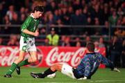 14 October 1998; Gary Breen of Republic of Ireland round Reginald Cini of Malta on his way to score his side's fifth goal during the UEFA Euro 2000 Group 8 Qualifier between Republic of Ireland and Malta at Lansdowne Road in Dublin. Photo by David Maher/Sportsfile.