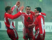 10 January 1998; John Caulfield of Cork City, hidden, is congratulated by team-mates, from left, Colin O'Brien, Ollie Cahill and Pat Morley after scoring his side's second goal during the Harp Lager League Cup First Round match between Monaghan United and Cork City at Gortakeegan in Monaghan. Photo by Ray McManus/Sportsfile.