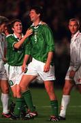 14 October 1998; Niall Quinn of Republic of Ireland, centre, celebrates with team-mate Robbie Keane, left, after scoring his side's fourth goal during the UEFA Euro 2000 Group 8 Qualifier between Republic of Ireland and Malta at Lansdowne Road in Dublin. Photo by Brendan Moran/Sportsfile.