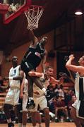 1 November 1997; Randall Mounts of Denny Notre Dame hangs from the basket after a slam-dunk during the ESB Superleague Basketball match between Denny Notre Dame and Killarney at the National Basketball Arena in Tallaght. Photo By Brendan Moran/Sportsfile.