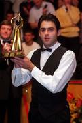 29 March 1998; Ronnie O'Sullivan lifts the Irish Masters Trophy after defeating Ken Doherty in the Final of the Benson and Hedges Irish Masters Snooker at Goffs in Kill, Kildare. Photo by Matt Browne/Sportsfile