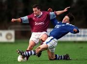 13 January 1999; Pakie Kelly of Cobh Ramblers is tackled by Sean Mulhall of Garda AFC during the Harp Lager League Cup First Round Replay match between Garda AFC and Cobh Ramblers at Westmanstown Sports Complex in Dublin. Photo by Matt Browne/Sportsfile