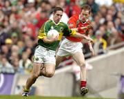 26 September 2004; Declan O'Sullivan, Kerry, in action against James Nallen, Mayo. Bank of Ireland All-Ireland Senior Football Championship Final, Kerry v Mayo, Croke Park, Dublin. Picture credit; Brendan Moran / SPORTSFILE *** Local Caption *** Any photograph taken by SPORTSFILE during, or in connection with, the 2004 Bank of Ireland All-Ireland Senior Football Final which displays GAA logos or contains an image or part of an image of any GAA intellectual property, or, which contains images of a GAA player/players in their playing uniforms, may only be used for editorial and non-advertising purposes.  Use of photographs for advertising, as posters or for purchase separately is strictly prohibited unless prior written approval has been obtained from the Gaelic Athletic Association.