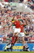 26 September 2004; William Kirby, Kerry, in action against Ciaran McDonald and Fergal Kelly, Mayo. Bank of Ireland All-Ireland Senior Football Championship Final, Kerry v Mayo, Croke Park, Dublin. Picture credit; Brendan Moran / SPORTSFILE *** Local Caption *** Any photograph taken by SPORTSFILE during, or in connection with, the 2004 Bank of Ireland All-Ireland Senior Football Final which displays GAA logos or contains an image or part of an image of any GAA intellectual property, or, which contains images of a GAA player/players in their playing uniforms, may only be used for editorial and non-advertising purposes.  Use of photographs for advertising, as posters or for purchase separately is strictly prohibited unless prior written approval has been obtained from the Gaelic Athletic Association.