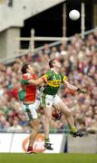26 September 2004; William Kirby, Kerry, in action against Fergal Kelly, Mayo. Bank of Ireland All-Ireland Senior Football Championship Final, Kerry v Mayo, Croke Park, Dublin. Picture credit; Brendan Moran / SPORTSFILE *** Local Caption *** Any photograph taken by SPORTSFILE during, or in connection with, the 2004 Bank of Ireland All-Ireland Senior Football Final which displays GAA logos or contains an image or part of an image of any GAA intellectual property, or, which contains images of a GAA player/players in their playing uniforms, may only be used for editorial and non-advertising purposes.  Use of photographs for advertising, as posters or for purchase separately is strictly prohibited unless prior written approval has been obtained from the Gaelic Athletic Association.