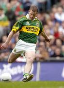 26 September 2004; Dara O Cinneide, Kerry, kicks a free against Mayo. Bank of Ireland All-Ireland Senior Football Championship Final, Kerry v Mayo, Croke Park, Dublin. Picture credit; Brendan Moran / SPORTSFILE *** Local Caption *** Any photograph taken by SPORTSFILE during, or in connection with, the 2004 Bank of Ireland All-Ireland Senior Football Final which displays GAA logos or contains an image or part of an image of any GAA intellectual property, or, which contains images of a GAA player/players in their playing uniforms, may only be used for editorial and non-advertising purposes.  Use of photographs for advertising, as posters or for purchase separately is strictly prohibited unless prior written approval has been obtained from the Gaelic Athletic Association.