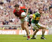 26 September 2004; Fergal Kelly, Mayo, in action against Dara O Cinneide, Kerry. Bank of Ireland All-Ireland Senior Football Championship Final, Kerry v Mayo, Croke Park, Dublin. Picture credit; Brendan Moran / SPORTSFILE *** Local Caption *** Any photograph taken by SPORTSFILE during, or in connection with, the 2004 Bank of Ireland All-Ireland Senior Football Final which displays GAA logos or contains an image or part of an image of any GAA intellectual property, or, which contains images of a GAA player/players in their playing uniforms, may only be used for editorial and non-advertising purposes.  Use of photographs for advertising, as posters or for purchase separately is strictly prohibited unless prior written approval has been obtained from the Gaelic Athletic Association.