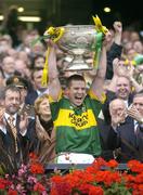 26 September 2004; Kerry captain Dara O Cinneide lifts the Sam Maguire cup after victory over Mayo. Bank of Ireland All-Ireland Senior Football Championship Final, Kerry v Mayo, Croke Park, Dublin. Picture credit; Brendan Moran / SPORTSFILE *** Local Caption *** Any photograph taken by SPORTSFILE during, or in connection with, the 2004 Bank of Ireland All-Ireland Senior Football Final which displays GAA logos or contains an image or part of an image of any GAA intellectual property, or, which contains images of a GAA player/players in their playing uniforms, may only be used for editorial and non-advertising purposes.  Use of photographs for advertising, as posters or for purchase separately is strictly prohibited unless prior written approval has been obtained from the Gaelic Athletic Association.