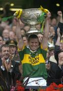 26 September 2004; Kerry captain Dara O Cinneide lifts the Sam Maguire cup in the company of President of the GAA Sean Kelly, left. Bank of Ireland All-Ireland Senior Football Championship Final, Kerry v Mayo, Croke Park, Dublin. Picture credit; Brendan Moran / SPORTSFILE *** Local Caption *** Any photograph taken by SPORTSFILE during, or in connection with, the 2004 Bank of Ireland All-Ireland Senior Football Final which displays GAA logos or contains an image or part of an image of any GAA intellectual property, or, which contains images of a GAA player/players in their playing uniforms, may only be used for editorial and non-advertising purposes.  Use of photographs for advertising, as posters or for purchase separately is strictly prohibited unless prior written approval has been obtained from the Gaelic Athletic Association.