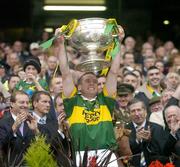 26 September 2004; Kerry captain Dara O Cinneide lifts the Sam Maguire cup after victory over Mayo. Bank of Ireland All-Ireland Senior Football Championship Final, Kerry v Mayo, Croke Park, Dublin. Picture credit; Brendan Moran / SPORTSFILE *** Local Caption *** Any photograph taken by SPORTSFILE during, or in connection with, the 2004 Bank of Ireland All-Ireland Senior Football Final which displays GAA logos or contains an image or part of an image of any GAA intellectual property, or, which contains images of a GAA player/players in their playing uniforms, may only be used for editorial and non-advertising purposes.  Use of photographs for advertising, as posters or for purchase separately is strictly prohibited unless prior written approval has been obtained from the Gaelic Athletic Association.