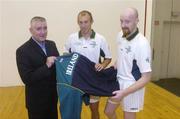 28 September 2004; Ireland's Handball 'Compromise Rules' squad gathered in Croke Park today for a last training session and presentation of special playing gear by O'Neills Sports, in advance of their travels to a major tournament in the Basque Country. Cormac Farrell, O'Neills Sports, left, shows squad members Eoin Kennedy, Dublin, and James Doyle, Armagh, right, the official Ireland tracksuit top. Croke Park, Dublin. Picture credit; Brian Lawless / SPORTSFILE