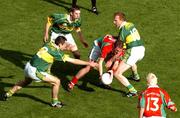 26 September 2004; Alan Dillon, Mayo, is tackled by Kerry's Tom O'Sullivan, left, Marc O'Se, centre, and Liam Hassett, right, while Mayo's Conor Mortimer, 13, looks on. Bank of Ireland All-Ireland Senior Football Championship Final, Kerry v Mayo, Croke Park, Dublin. Picture credit; Pat Murphy / SPORTSFILE *** Local Caption *** Any photograph taken by SPORTSFILE during, or in connection with, the 2004 Bank of Ireland All-Ireland Senior Football Final which displays GAA logos or contains an image or part of an image of any GAA intellectual property, or, which contains images of a GAA player/players in their playing uniforms, may only be used for editorial and non-advertising purposes.  Use of photographs for advertising, as posters or for purchase separately is strictly prohibited unless prior written approval has been obtained from the Gaelic Athletic Association.