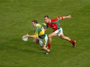 26 September 2004; Seamus Moynihan, Kerry, in action against David Brady, Mayo. Bank of Ireland All-Ireland Senior Football Championship Final, Kerry v Mayo, Croke Park, Dublin. Picture credit; Pat Murphy / SPORTSFILE *** Local Caption *** Any photograph taken by SPORTSFILE during, or in connection with, the 2004 Bank of Ireland All-Ireland Senior Football Final which displays GAA logos or contains an image or part of an image of any GAA intellectual property, or, which contains images of a GAA player/players in their playing uniforms, may only be used for editorial and non-advertising purposes.  Use of photographs for advertising, as posters or for purchase separately is strictly prohibited unless prior written approval has been obtained from the Gaelic Athletic Association.