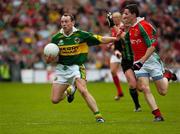 26 September 2004; Seamus Moynihan, Kerry, in action against Peadar Gardiner, Mayo. Bank of Ireland All-Ireland Senior Football Championship Final, Kerry v Mayo, Croke Park, Dublin. Picture credit; Ray McManus / SPORTSFILE *** Local Caption *** Any photograph taken by SPORTSFILE during, or in connection with, the 2004 Bank of Ireland All-Ireland Senior Football Final which displays GAA logos or contains an image or part of an image of any GAA intellectual property, or, which contains images of a GAA player/players in their playing uniforms, may only be used for editorial and non-advertising purposes.  Use of photographs for advertising, as posters or for purchase separately is strictly prohibited unless prior written approval has been obtained from the Gaelic Athletic Association.
