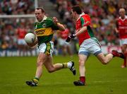 26 September 2004; Seamus Moynihan, Kerry, in action against Peadar Gardiner, Mayo. Bank of Ireland All-Ireland Senior Football Championship Final, Kerry v Mayo, Croke Park, Dublin. Picture credit; Ray McManus / SPORTSFILE *** Local Caption *** Any photograph taken by SPORTSFILE during, or in connection with, the 2004 Bank of Ireland All-Ireland Senior Football Final which displays GAA logos or contains an image or part of an image of any GAA intellectual property, or, which contains images of a GAA player/players in their playing uniforms, may only be used for editorial and non-advertising purposes.  Use of photographs for advertising, as posters or for purchase separately is strictly prohibited unless prior written approval has been obtained from the Gaelic Athletic Association.