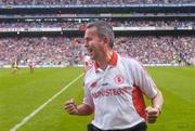 26 September 2004; Tyrone minor manager Liam Doyle celebrates at the final whistle. All-Ireland Minor Football Championship Final, Kerry v Tyrone, Croke Park, Dublin. Picture credit; Brian Lawless / SPORTSFILE *** Local Caption *** Any photograph taken by SPORTSFILE during, or in connection with, the 2004 All-Ireland Minor Football Final which displays GAA logos or contains an image or part of an image of any GAA intellectual property, or, which contains images of a GAA player/players in their playing uniforms, may only be used for editorial and non-advertising purposes.  Use of photographs for advertising, as posters or for purchase separately is strictly prohibited unless prior written approval has been obtained from the Gaelic Athletic Association.