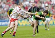 26 September 2004; Ciaran Kelliher, Kerry, in action against John Gilmore, Tyrone. All-Ireland Minor Football Championship Final, Kerry v Tyrone, Croke Park, Dublin. Picture credit; Brian Lawless / SPORTSFILE *** Local Caption *** Any photograph taken by SPORTSFILE during, or in connection with, the 2004 All-Ireland Minor Football Final which displays GAA logos or contains an image or part of an image of any GAA intellectual property, or, which contains images of a GAA player/players in their playing uniforms, may only be used for editorial and non-advertising purposes.  Use of photographs for advertising, as posters or for purchase separately is strictly prohibited unless prior written approval has been obtained from the Gaelic Athletic Association.