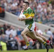 26 September 2004; Brian Moran, Kerry, in action against Niall Kerr, Tyrone. All-Ireland Minor Football Championship Final, Kerry v Tyrone, Croke Park, Dublin. Picture credit; Brian Lawless / SPORTSFILE *** Local Caption *** Any photograph taken by SPORTSFILE during, or in connection with, the 2004 All-Ireland Minor Football Final which displays GAA logos or contains an image or part of an image of any GAA intellectual property, or, which contains images of a GAA player/players in their playing uniforms, may only be used for editorial and non-advertising purposes.  Use of photographs for advertising, as posters or for purchase separately is strictly prohibited unless prior written approval has been obtained from the Gaelic Athletic Association.