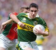 26 September 2004; Declan O'Sullivan, Kerry, in action against Dermot Geraghty, Mayo. Bank of Ireland All-Ireland Senior Football Championship Final, Kerry v Mayo, Croke Park, Dublin. Picture credit; Brian Lawless / SPORTSFILE *** Local Caption *** Any photograph taken by SPORTSFILE during, or in connection with, the 2004 Bank of Ireland All-Ireland Senior Football Final which displays GAA logos or contains an image or part of an image of any GAA intellectual property, or, which contains images of a GAA player/players in their playing uniforms, may only be used for editorial and non-advertising purposes.  Use of photographs for advertising, as posters or for purchase separately is strictly prohibited unless prior written approval has been obtained from the Gaelic Athletic Association.