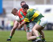 26 September 2004; David Heaney, Mayo, in action against Declan O'Sullivan (11) and Dara O'Cinneide, Kerry. Bank of Ireland All-Ireland Senior Football Championship Final, Kerry v Mayo, Croke Park, Dublin. Picture credit; Brian Lawless / SPORTSFILE *** Local Caption *** Any photograph taken by SPORTSFILE during, or in connection with, the 2004 Bank of Ireland All-Ireland Senior Football Final which displays GAA logos or contains an image or part of an image of any GAA intellectual property, or, which contains images of a GAA player/players in their playing uniforms, may only be used for editorial and non-advertising purposes.  Use of photographs for advertising, as posters or for purchase separately is strictly prohibited unless prior written approval has been obtained from the Gaelic Athletic Association.