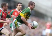 26 September 2004; Dara O'Cinneide, Kerry, in action against Gary Ruane, Mayo. Bank of Ireland All-Ireland Senior Football Championship Final, Kerry v Mayo, Croke Park, Dublin. Picture credit; Brian Lawless / SPORTSFILE *** Local Caption *** Any photograph taken by SPORTSFILE during, or in connection with, the 2004 Bank of Ireland All-Ireland Senior Football Final which displays GAA logos or contains an image or part of an image of any GAA intellectual property, or, which contains images of a GAA player/players in their playing uniforms, may only be used for editorial and non-advertising purposes.  Use of photographs for advertising, as posters or for purchase separately is strictly prohibited unless prior written approval has been obtained from the Gaelic Athletic Association.