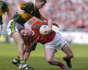 26 September 2004; Michael Conroy, Mayo, in action against Michael McCarthy, Kerry. Bank of Ireland All-Ireland Senior Football Championship Final, Kerry v Mayo, Croke Park, Dublin. Picture credit; Brian Lawless / SPORTSFILE *** Local Caption *** Any photograph taken by SPORTSFILE during, or in connection with, the 2004 Bank of Ireland All-Ireland Senior Football Final which displays GAA logos or contains an image or part of an image of any GAA intellectual property, or, which contains images of a GAA player/players in their playing uniforms, may only be used for editorial and non-advertising purposes.  Use of photographs for advertising, as posters or for purchase separately is strictly prohibited unless prior written approval has been obtained from the Gaelic Athletic Association.