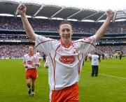 26 September 2004; Colm Cavanagh, Tyrone, celebrates after victory over Kerry. All-Ireland Minor Football Championship Final, Kerry v Tyrone, Croke Park, Dublin. Picture credit; Damien Eagers / SPORTSFILE *** Local Caption *** Any photograph taken by SPORTSFILE during, or in connection with, the 2004 All-Ireland Minor  Football Final which displays GAA logos or contains an image or part of an image of any GAA intellectual property, or, which contains images of a GAA player/players in their playing uniforms, may only be used for editorial and non-advertising purposes.  Use of photographs for advertising, as posters or for purchase separately is strictly prohibited unless prior written approval has been obtained from the Gaelic Athletic Association.