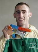30 September 2004; Derek Malone, a member of the Ireland Paralympic team, and Bronze medallist in the T38 800m, on the teams arrival home from Athens. Dublin Airport, Dublin. Picture credit; Brian Lawless / SPORTSFILE