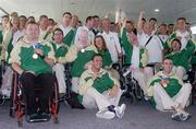 30 September 2004; The Ireland Paralympic team celebrate their success in the Athens Paralympic games on their arrival in Dublin Airport, Dublin. Picture credit; Brian Lawless / SPORTSFILE