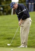 30 September 2004; Paul McGinley watches his pitch onto the 17th green during round one of the American Express World Golf Championship 2004, Mount Juliet Golf Club, Thomastown, Co. Kilkenny. Picture credit; Matt Browne / SPORTSFILE