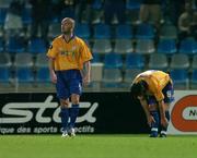 30 September 2004; Dejected Shelbourne players Dave Rogers, left, and Stuart Byrne look on in disappointment after Acimovic Milemko had scored Lille's first goal. UEFA cup, First Round, Second Leg, Lille v Shelbourne, Stade Metropole, Lille, France. Picture credit; David Maher / SPORTSFILE