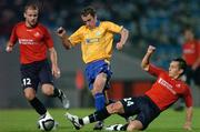 30 September 2004; Ollie Cahill, Shelbourne, in action against Mathieu Boymer, left, and Christophe Landri, Lille. UEFA cup, First Round, Second Leg, Lille v Shelbourne, Stade Metropole, Lille, France. Picture credit; David Maher / SPORTSFILE