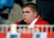 30 September 2004; A dejected Shelbourne fan watches on during the closing stages of the game. UEFA cup, First Round, Second Leg, Lille v Shelbourne, Stade Metropole, Lille, France. Picture credit; David Maher / SPORTSFILE