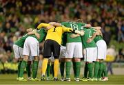 15 October 2013; The Republic of Ireland team form a huddle before the game. 2014 FIFA World Cup Qualifier, Group C, Republic of Ireland v Kazakhstan, Aviva Stadium, Lansdowne Road, Dublin. Picture credit: Ramsey Cardy / SPORTSFILE
