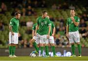 15 October 2013; Republic of Ireland players, from left, Andy Reid, Robbie Keane and Anthony Stokes react as they prepare to restart the game following Kazakhstan's first goal. 2014 FIFA World Cup Qualifier, Group C, Republic of Ireland v Kazakhstan, Aviva Stadium, Lansdowne Road, Dublin. Picture credit: Brendan Moran / SPORTSFILE