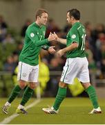 15 October 2013; Republic of Ireland's Aiden McGeady, left, comes on as a substitute for Andy Reid in the second half. 2014 FIFA World Cup Qualifier, Group C, Republic of Ireland v Kazakhstan, Aviva Stadium, Lansdowne Road, Dublin. Picture credit: Brendan Moran / SPORTSFILE