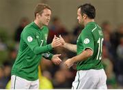 15 October 2013; Republic of Ireland's Aiden McGeady, left, comes on as a substitute for Andy Reid in the second half. 2014 FIFA World Cup Qualifier, Group C, Republic of Ireland v Kazakhstan, Aviva Stadium, Lansdowne Road, Dublin. Picture credit: Brendan Moran / SPORTSFILE