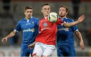 16 October 2013; Dylan Connolly, Shelbourne, in action against Shaun Kelly, left, and Jason Hughes, Limerick. Airtricity League Premier Division, Limerick FC v Shelbourne FC, Thomond Park, Limerick. Picture credit: Diarmuid Greene / SPORTSFILE