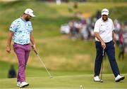 19 July 2025; Jon Rahm of Spain and Shane Lowry of Ireland on the first green during day three of The 153rd Open Championship at Royal Portrush Golf Club in Portrush, Antrim. Photo by Ramsey Cardy/Sportsfile