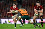 19 July 2025; Hugo Keenan of British & Irish Lions is tackled by Nick Champion de Crespigny of Australia during the first test match between Australia and the British & Irish Lions at Suncorp Stadium in Brisbane, Australia. Photo by Brendan Moran/Sportsfile