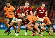19 July 2025; Ellis Genge of British & Irish Lions is tackled by James Slipper of Australia during the first test match between Australia and the British & Irish Lions at Suncorp Stadium in Brisbane, Australia. Photo by Brendan Moran/Sportsfile