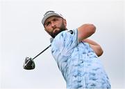 19 July 2025; Jon Rahm of Spain watches his tee shot on the second hole during day three of The 153rd Open Championship at Royal Portrush Golf Club in Portrush, Antrim. Photo by Ramsey Cardy/Sportsfile