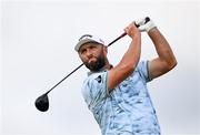 19 July 2025; Jon Rahm of Spain watches his tee shot on the second hole during day three of The 153rd Open Championship at Royal Portrush Golf Club in Portrush, Antrim. Photo by Ramsey Cardy/Sportsfile