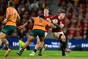 19 July 2025; Joe McCarthy of British & Irish Lions is tackled by Allan Alaalatoa of Australia during the first test match between Australia and the British & Irish Lions at Suncorp Stadium in Brisbane, Australia. Photo by Brendan Moran/Sportsfile