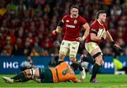 19 July 2025; Joe McCarthy of British & Irish Lions evades the tackle of Australia's Jeremy Williams during the first test match between Australia and the British & Irish Lions at Suncorp Stadium in Brisbane, Australia. Photo by Brendan Moran/Sportsfile