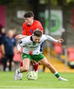 19 July 2025; Cathal O'Sullivan of Cork City is tackled by Kevin Maguire of Leicester Celtic during the Sports Direct Men’s FAI Cup second round match between Cork City and Leicester Celtic at Turner’s Cross in Cork. Photo by Stephen McCarthy/Sportsfile