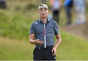 19 July 2025; Haotong Li of China reacts to a missed putt on the eighth green during day three of The 153rd Open Championship at Royal Portrush Golf Club in Portrush, Antrim. Photo by Ramsey Cardy/Sportsfile